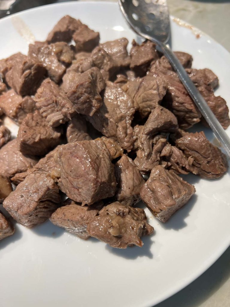 cooked top sirloin placed on a plate