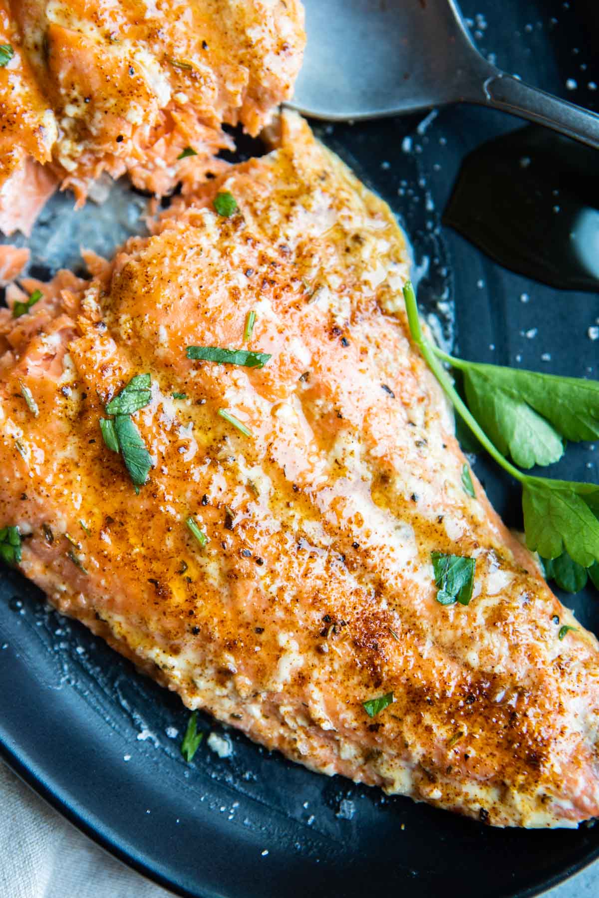 moist and tender slow roasted salmon topped with cajun spices and honey butter