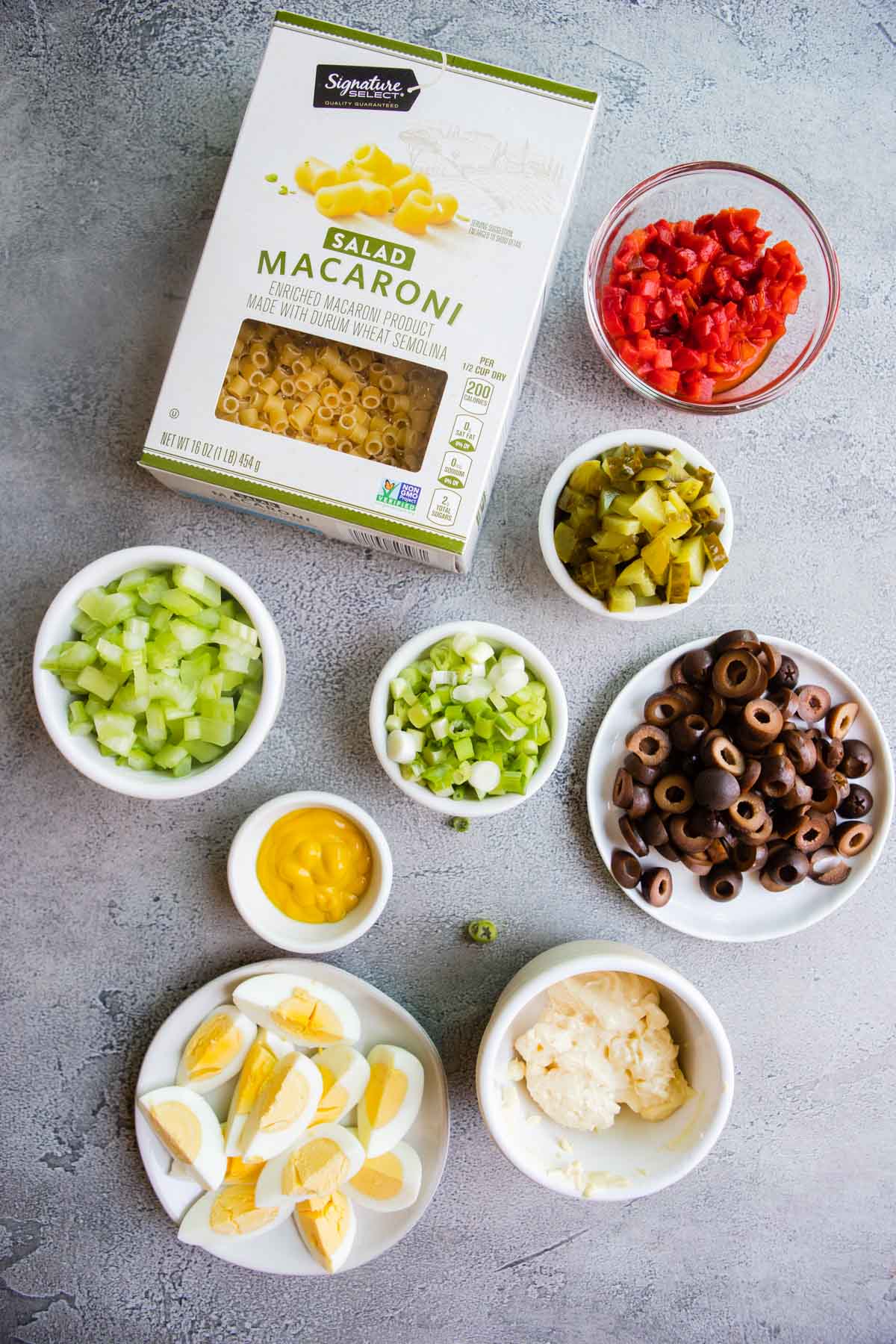 Ingredients shown are measured into bowls and used to prepare Southern Macaroni Salad.