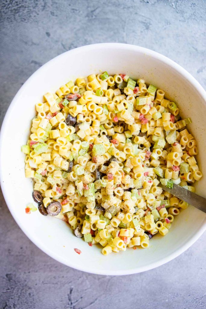 Creamy dressing coating a Southern Macaroni salad.