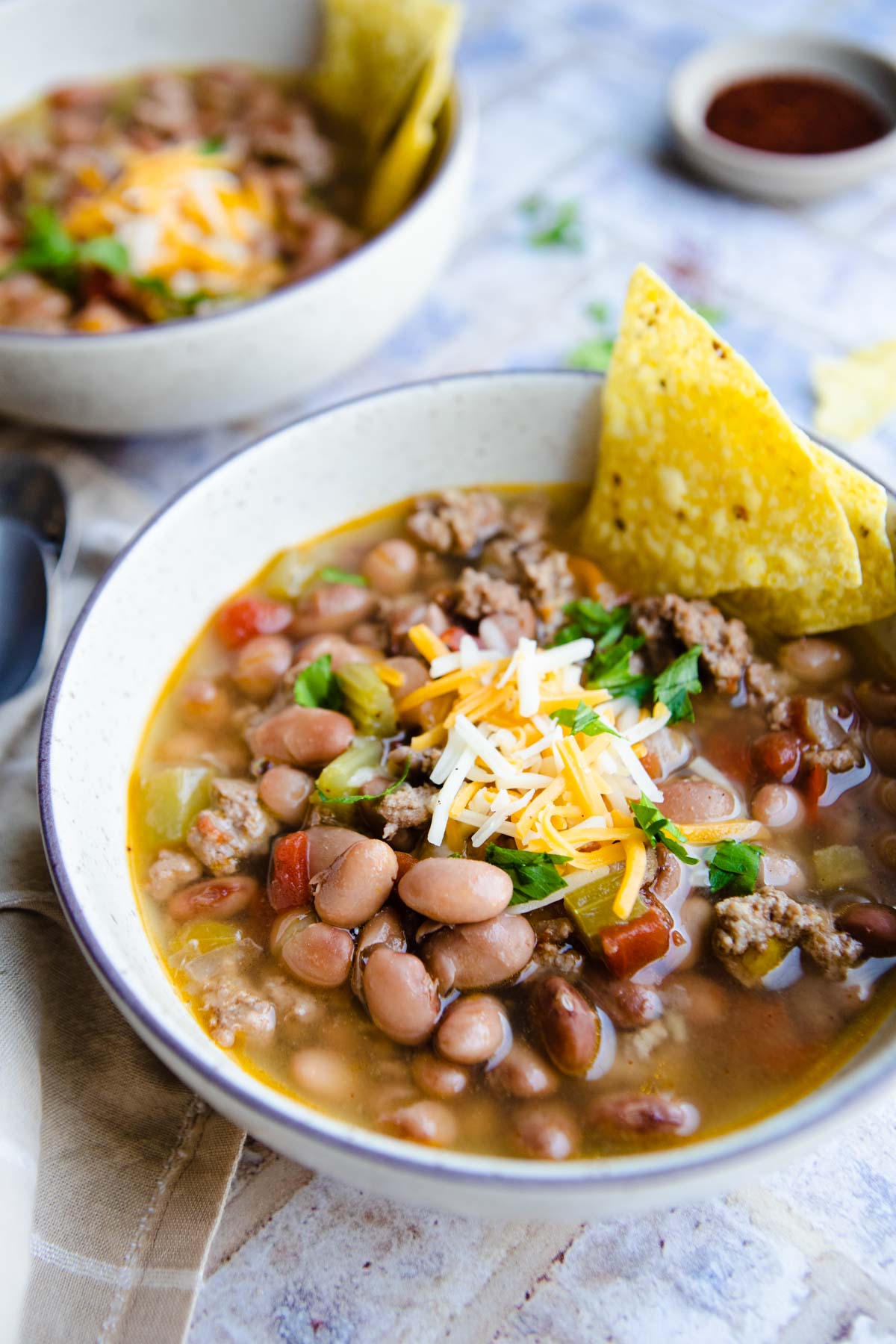 pinto bean soup cooked in the pressure cooker in a beige bowl