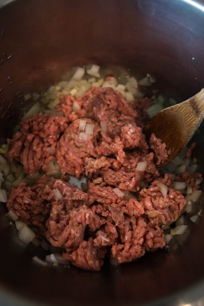 raw ground turkey and onions sauteing in the Instant pot