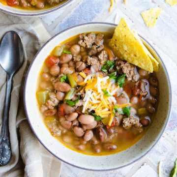 a speckled beige bowl filled with Instant Pot bean soup with ground turkey