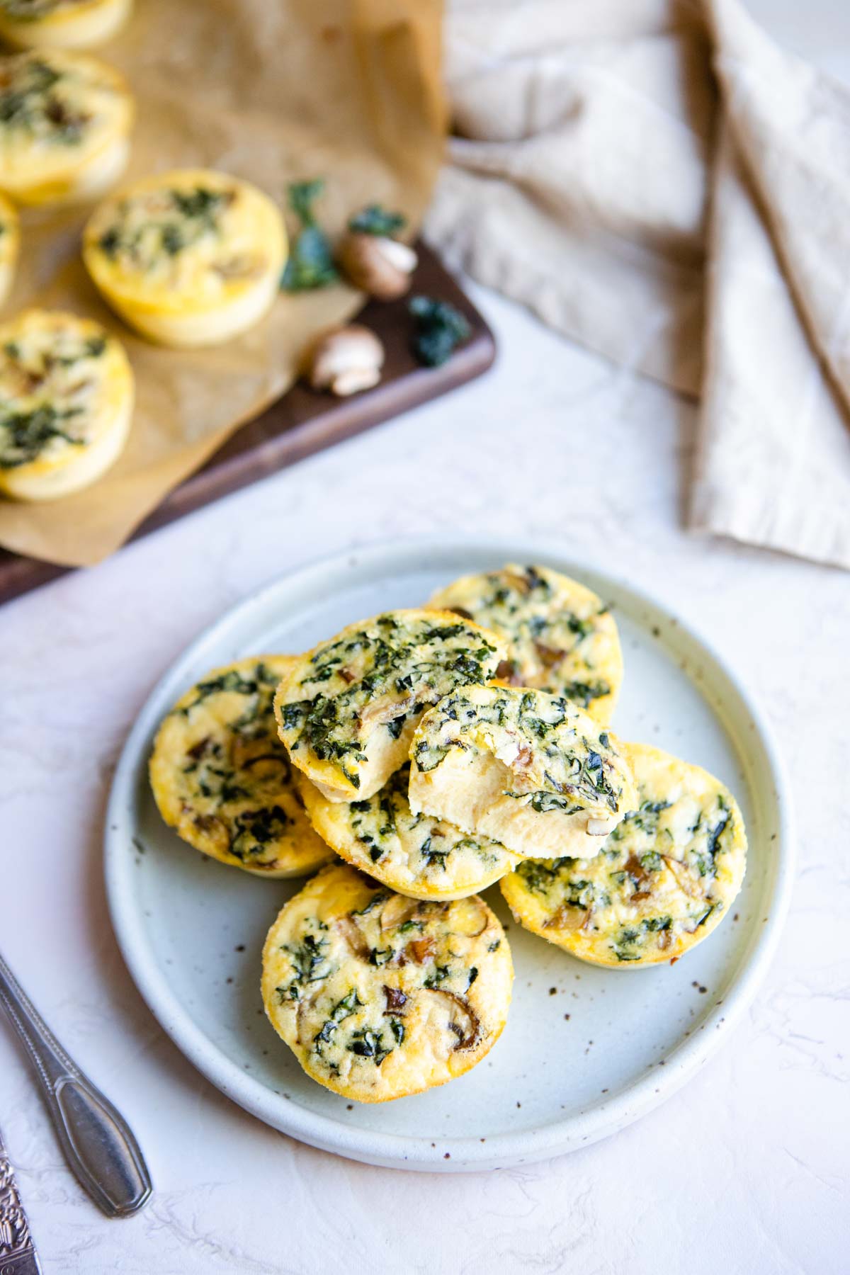 a stack of baked egg bites on a gray plate