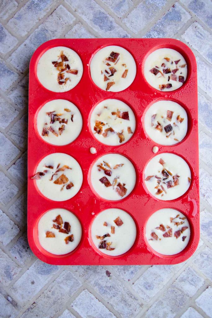 bacon and cheese egg bites ready to go in the oven