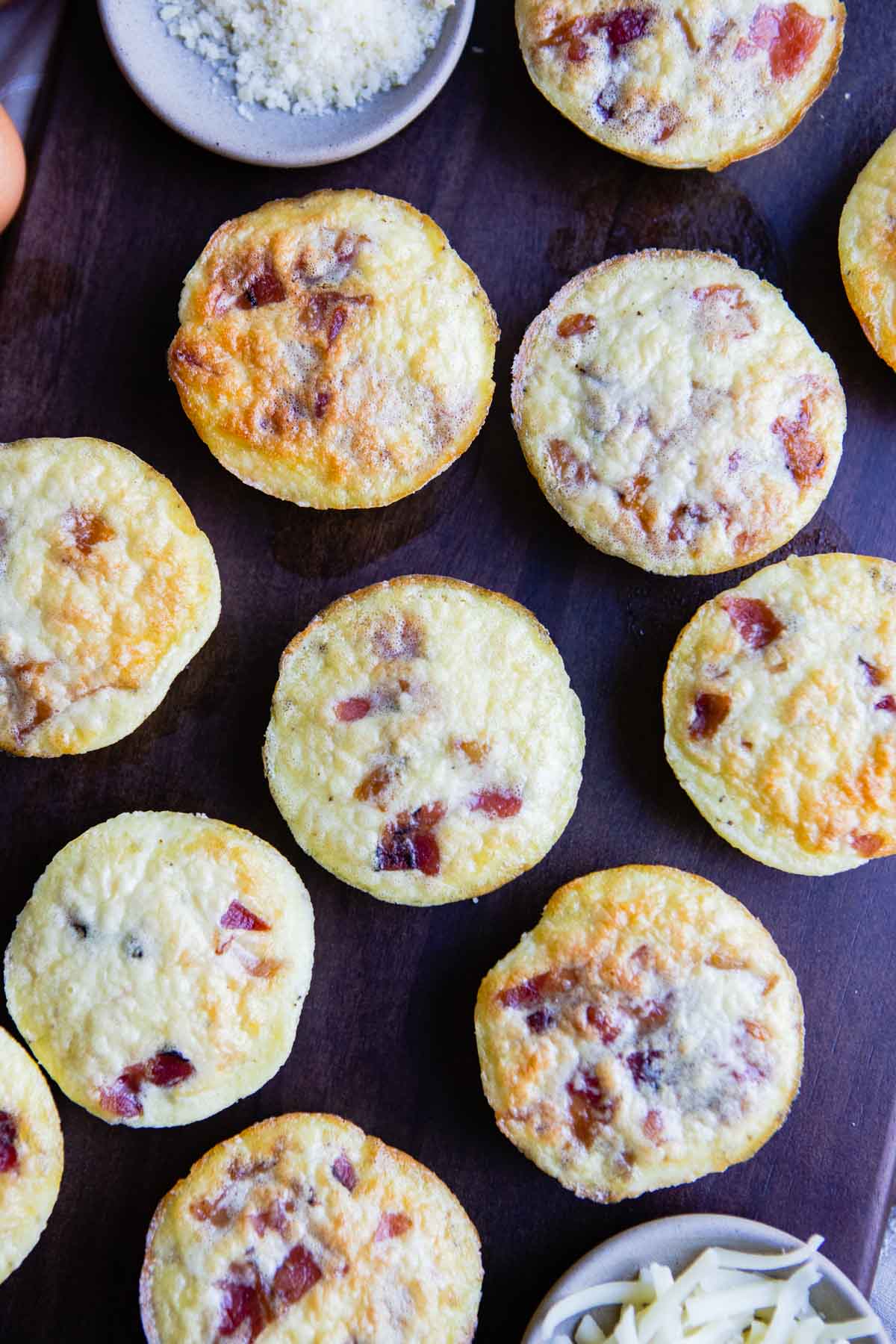 cooked bacon egg bites are placed on a platter ready to be served