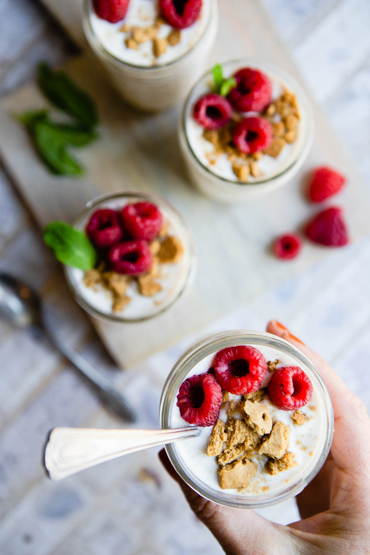 woman holding oats in a mason jar