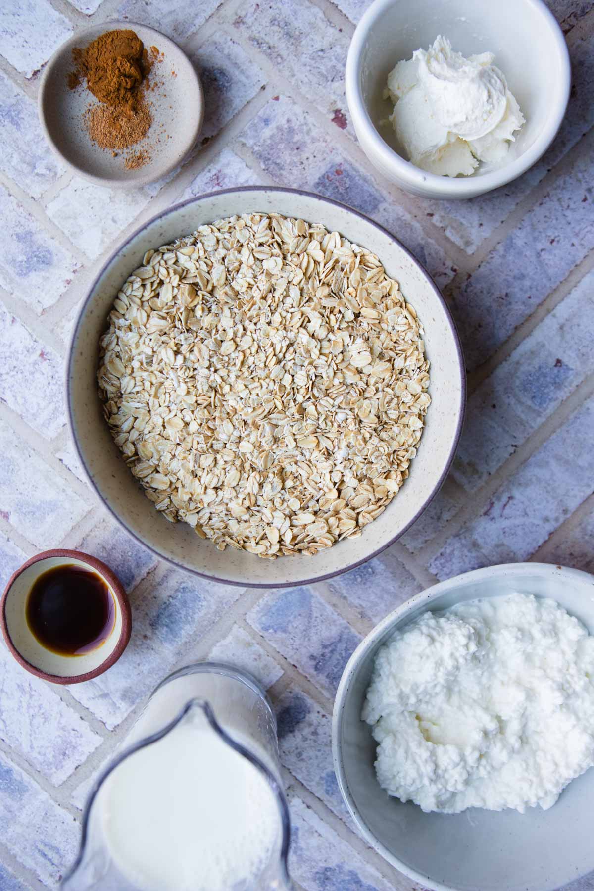 ingredients to make overnight oats in small bowls 