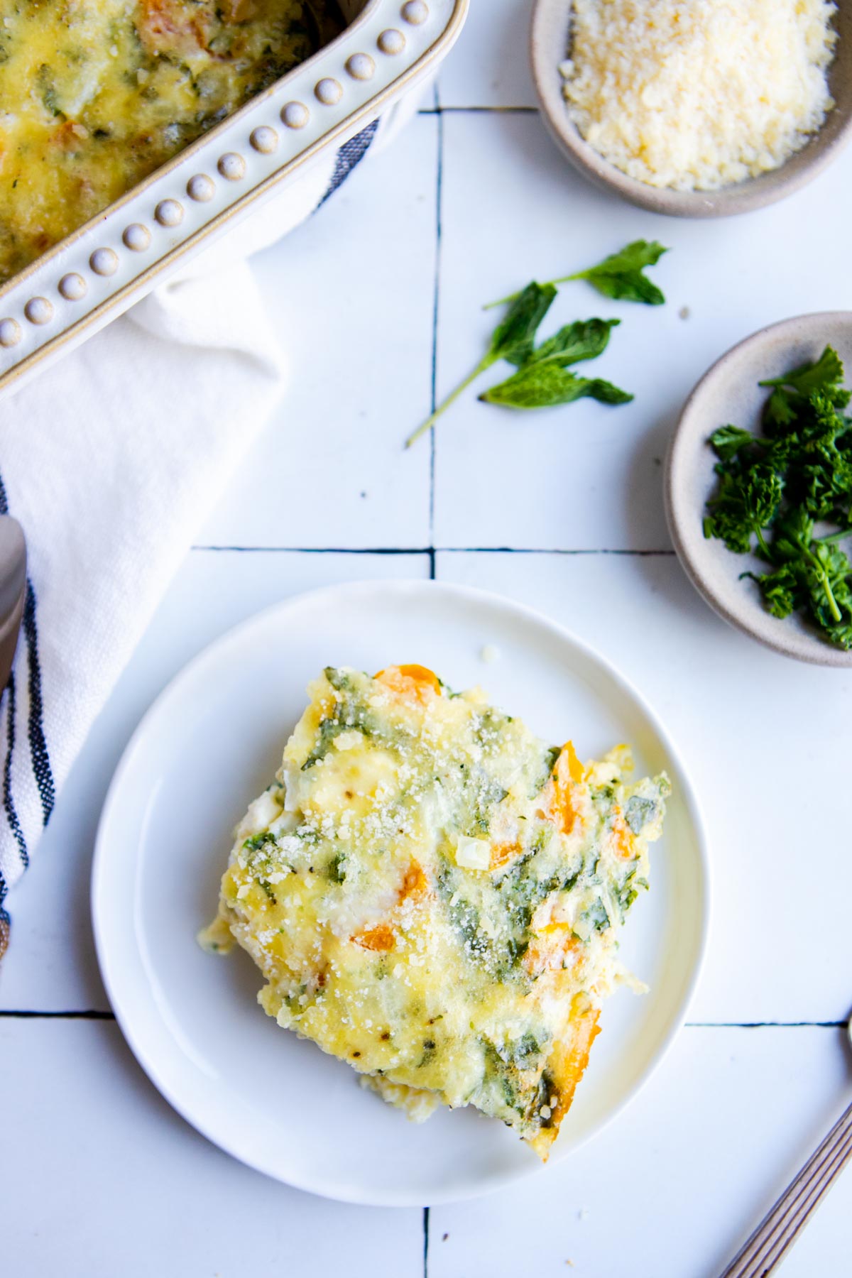 a piece of veggie and cottage cheese egg bake on a white plate 