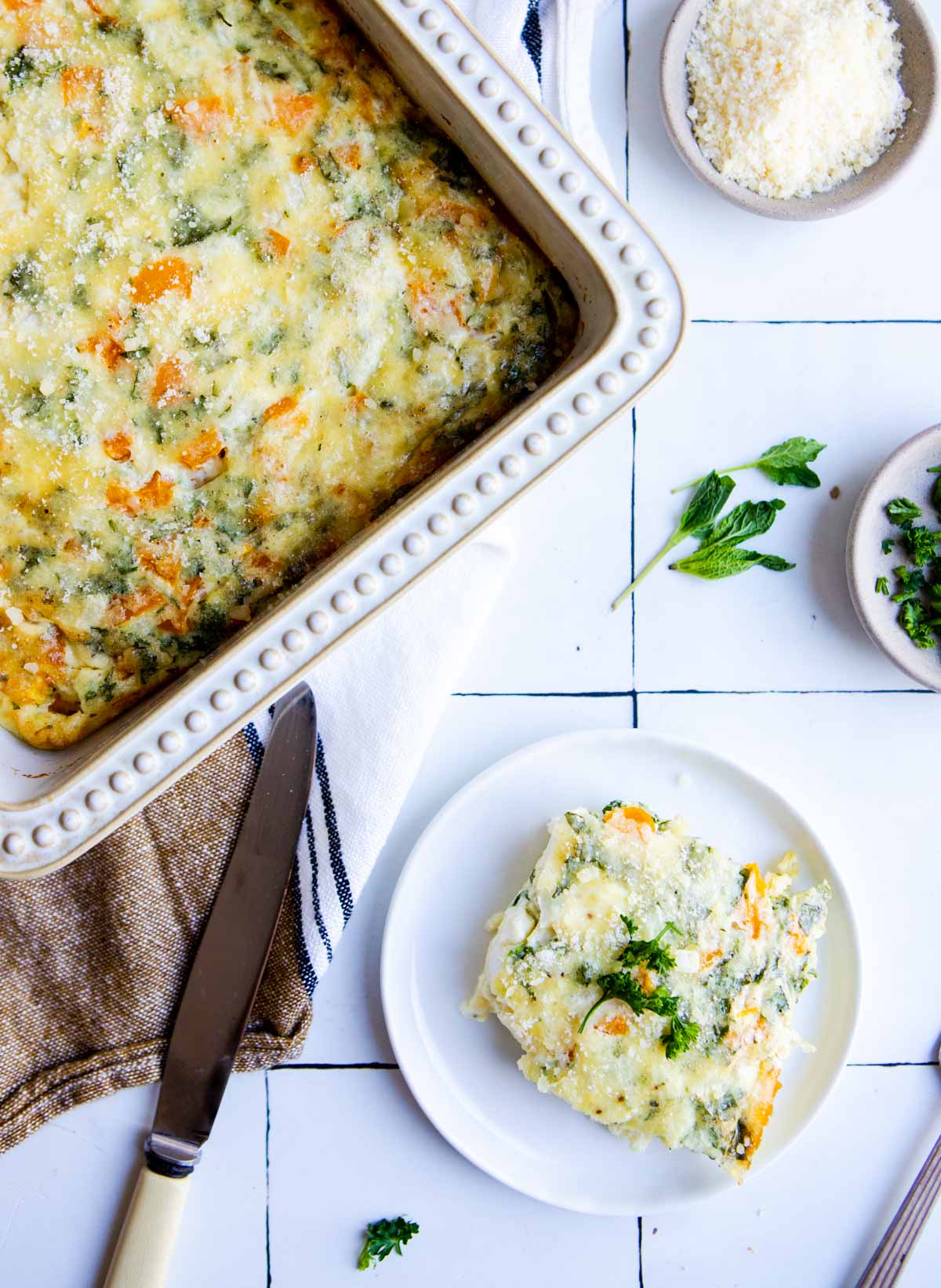 cottage cheese egg bake in a casserole dish and a single serving on a white plate