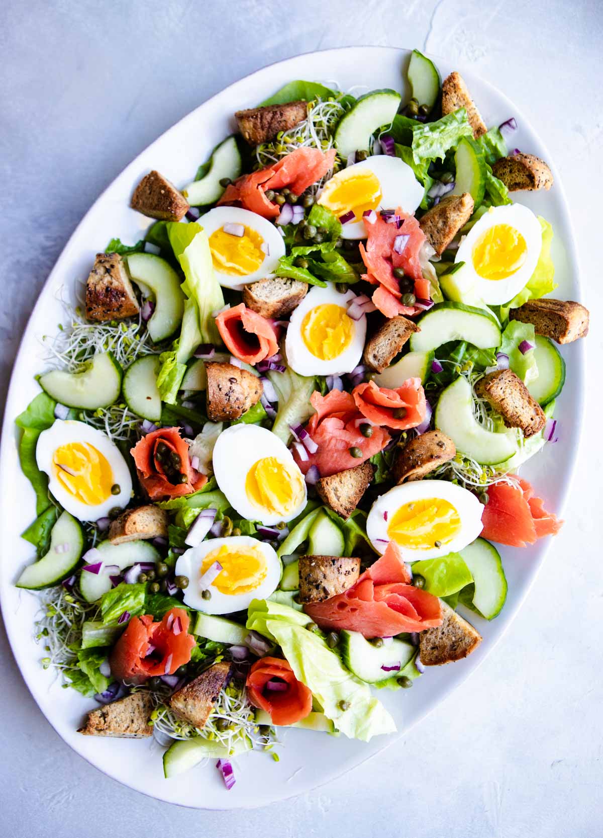 a smoked salmon salad ready to be dressed and served