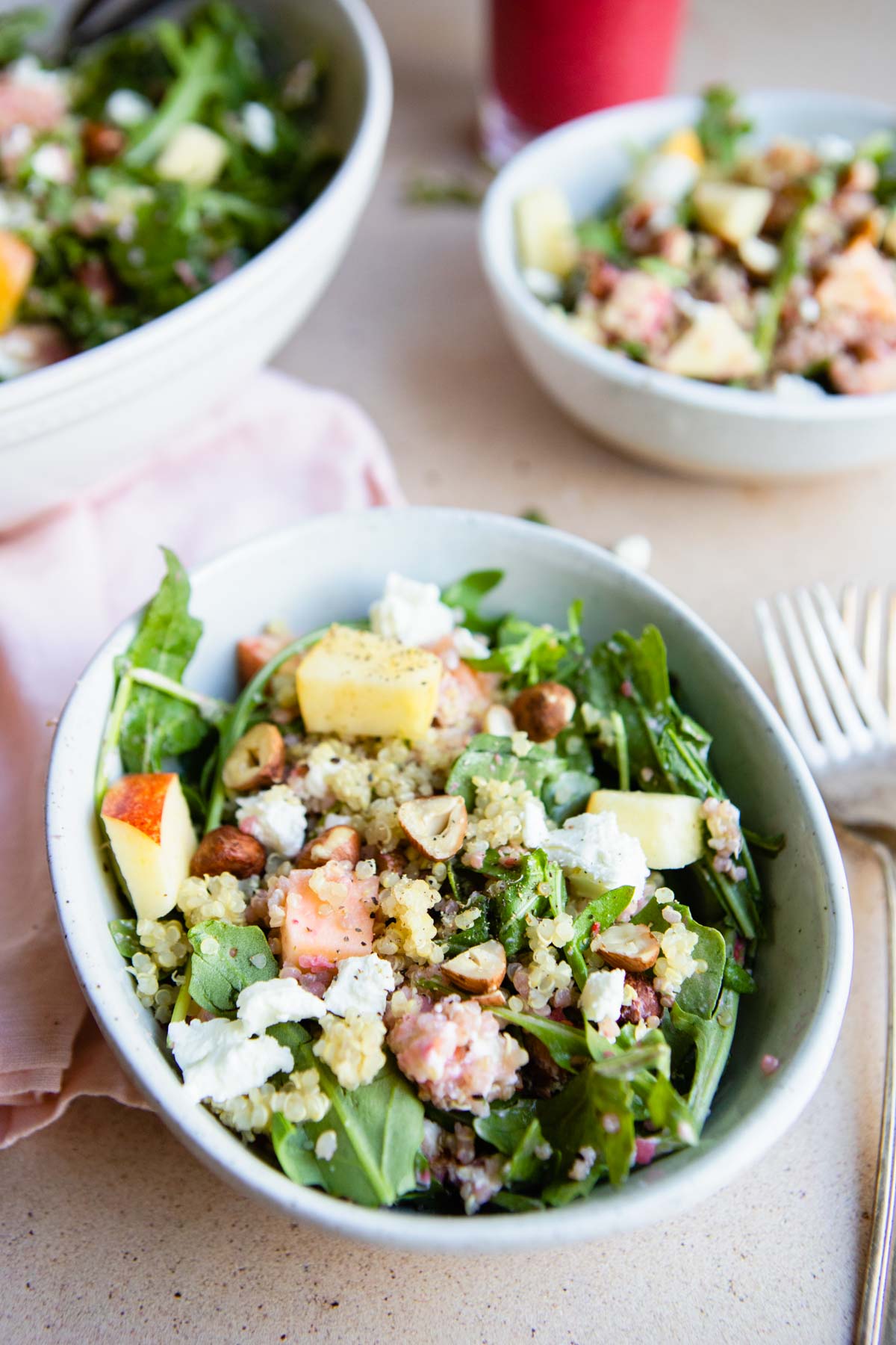 arugula quinoa salad with goat cheese and hazelnuts and apples