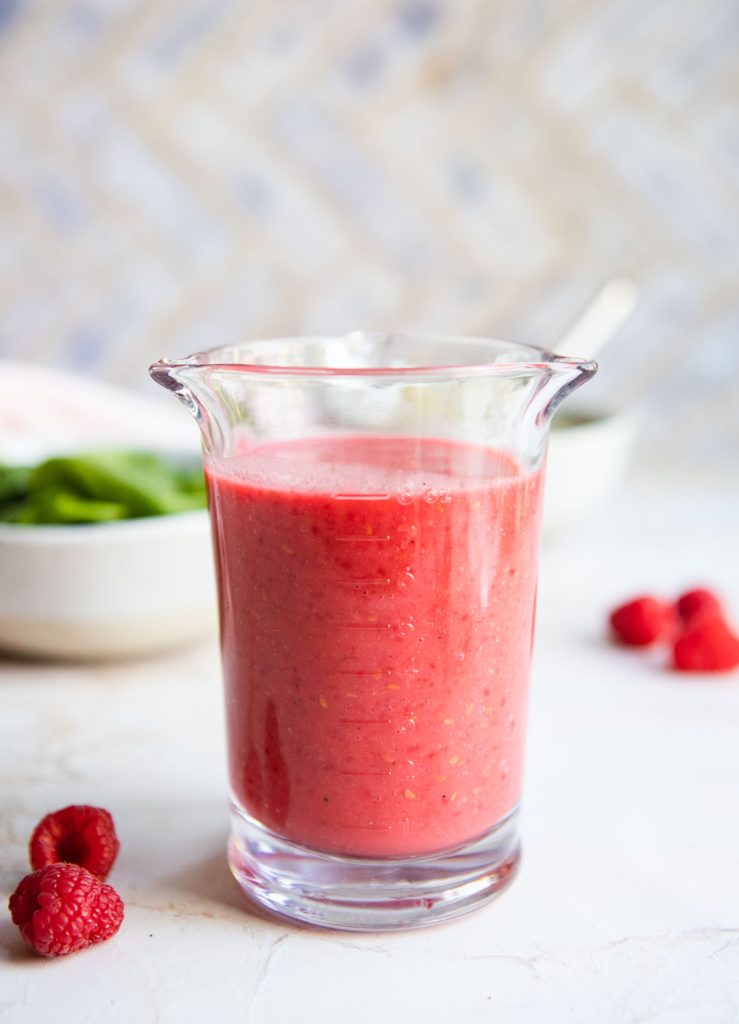 raspberry vinaigrette in a vintage glass measuring cup