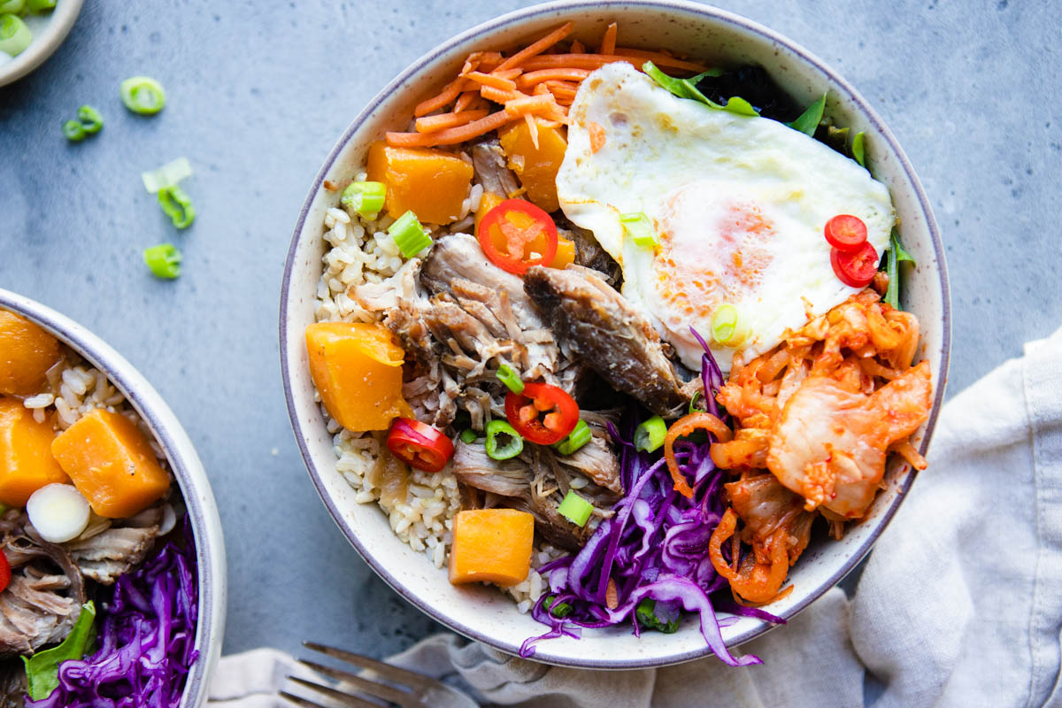 shredded asian style pork with squash, red cabbage, carrots, kimchi and squash 