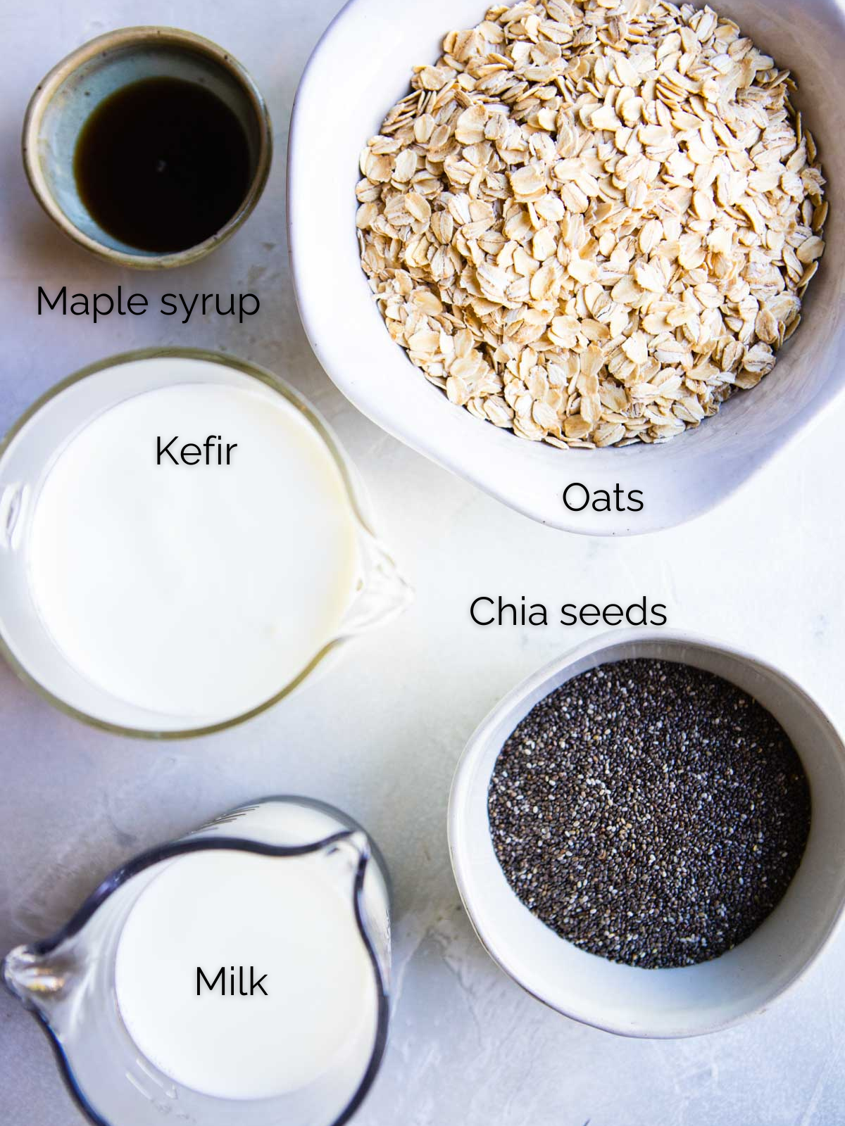 ingredients to make kefir overnight oats in glass bowls 