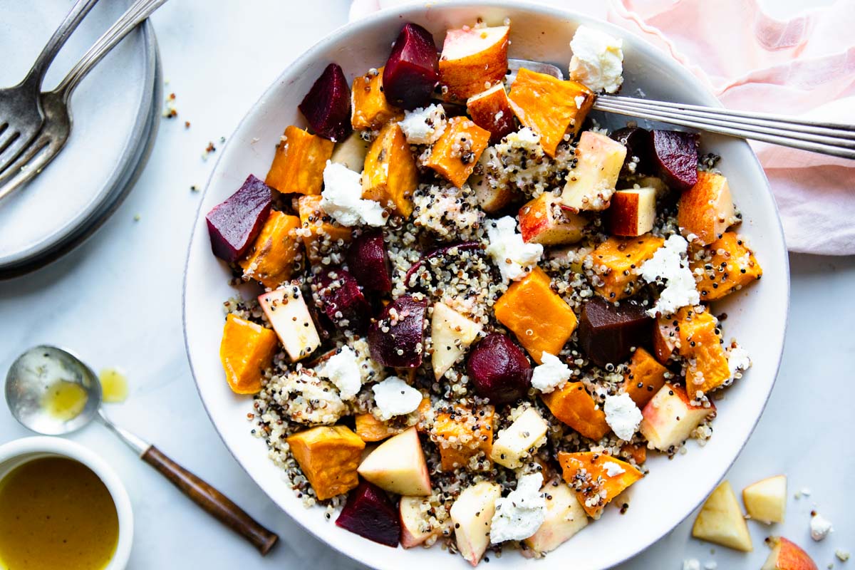 beet quinoa salad in a bowl with maple vinaigrette dressing 