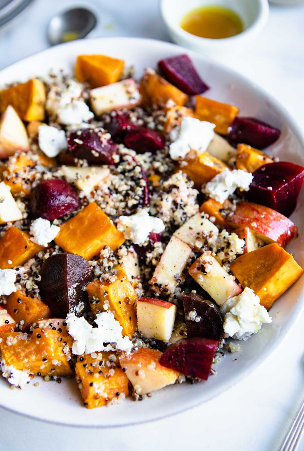 tossed beet and quinoa salad with roasted sweet potatoes, apples and goat cheese 