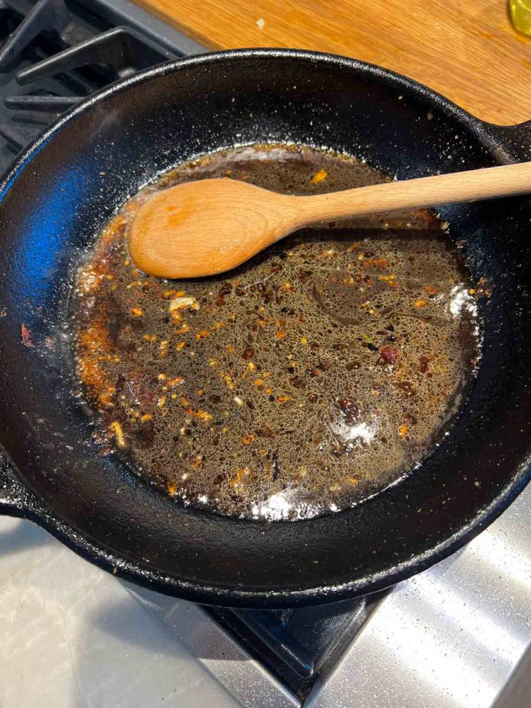 teriyaki sauce ingredients added to a pan