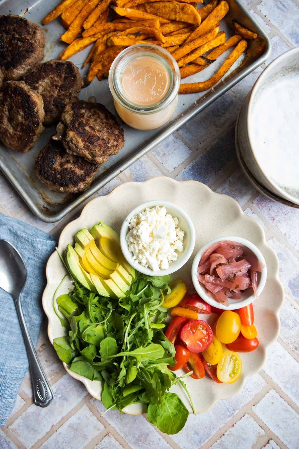 hamburger bowls ingredients ready to assemble on a platter