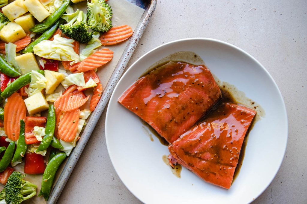 salmon filets marinating in teriyaki sauce