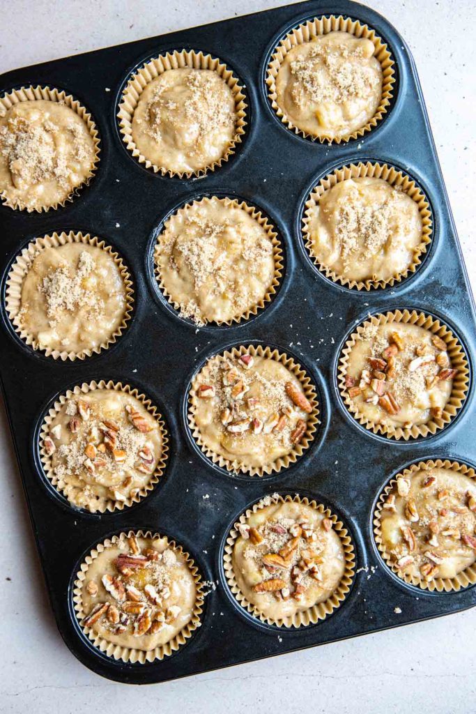 banana protein muffin batter added to lined muffin cups