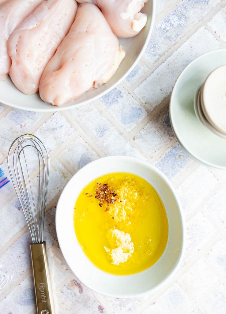 lemon citrus marinade for air fryer chicken in a white bowl