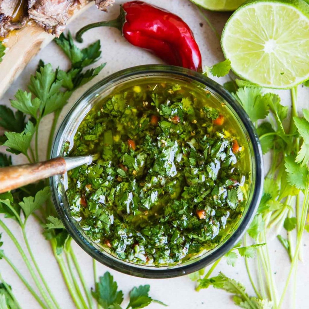 a small glass bowl filled with cilantro chimichurri sauce