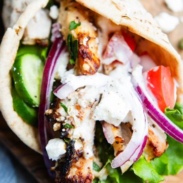 whole wheat pita wrap filled with Mediterranean chicken and veggies