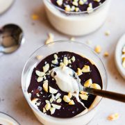 magic shell Greek yogurt cup garnished with peanuts in a glass cup