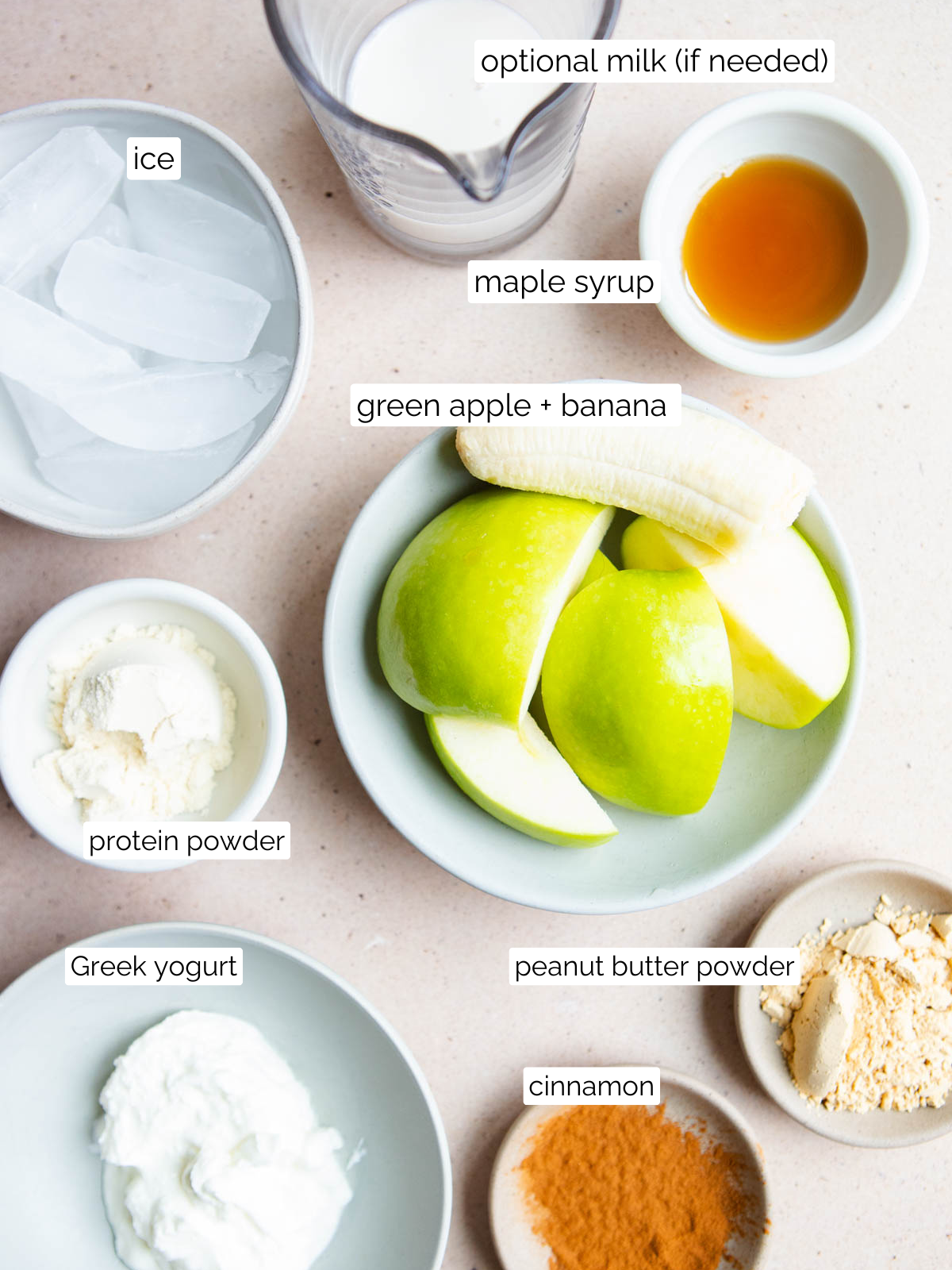 apple smoothie ingredients on small plates and bowls 