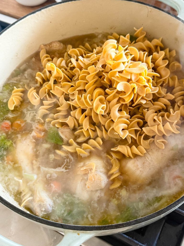 egg noodles added a large pot of simmering chicken soup