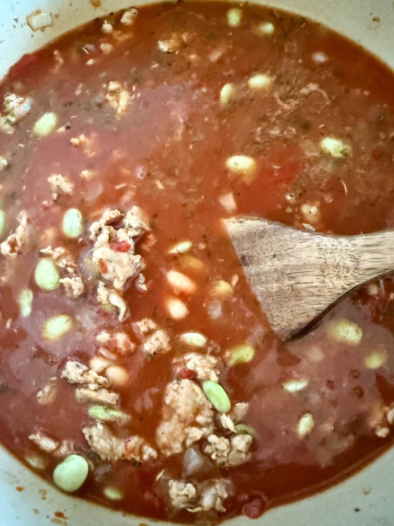 pasta e fagioli soup starting to simmer in a large Dutch oven