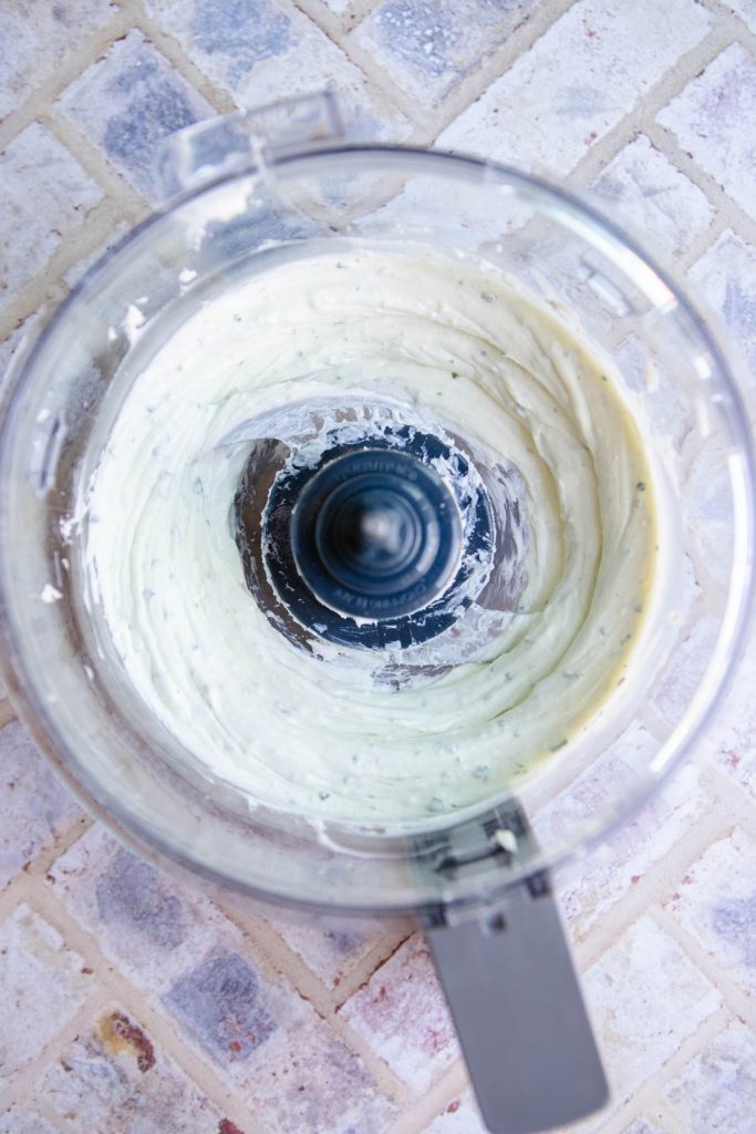 blended goat cheese dip in a food processor 