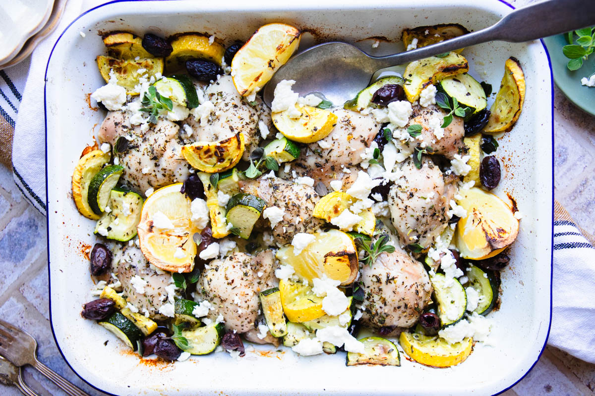 lemon Greek chicken in a white baking pan ready to be served