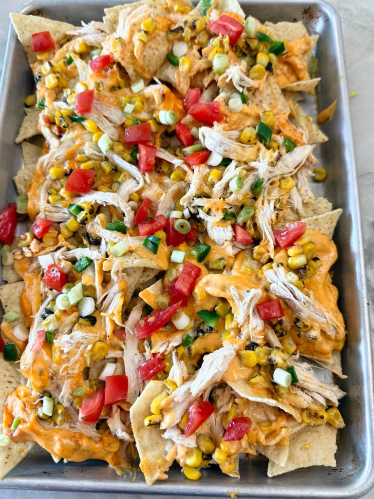 shredded chicken healthy nachos on a sheet pan