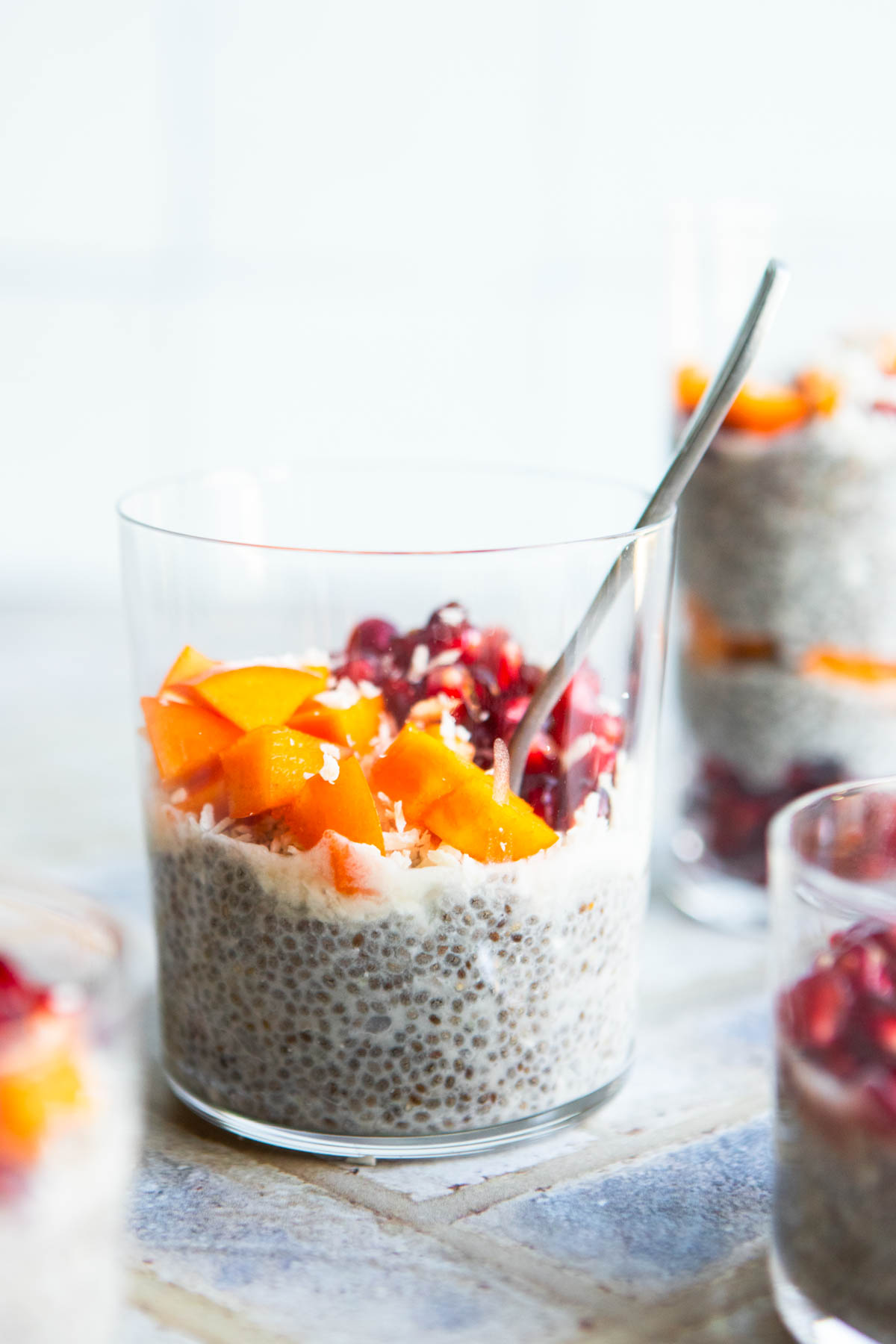 healthy chia pudding garnished with fresh fruit and shredded coconut