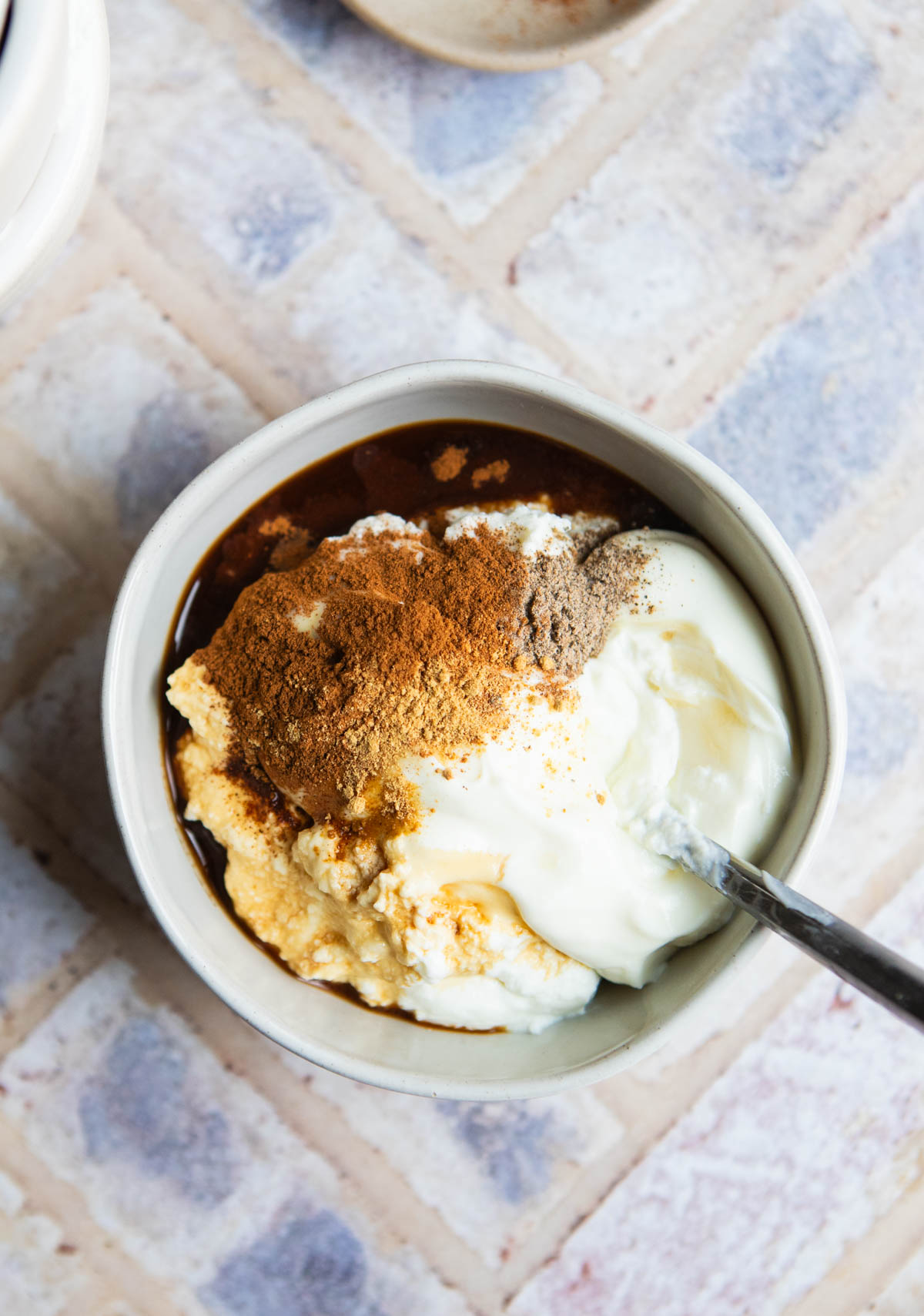 ingredients to make a yogurt fruit dip in a bowl ready to be mixed up