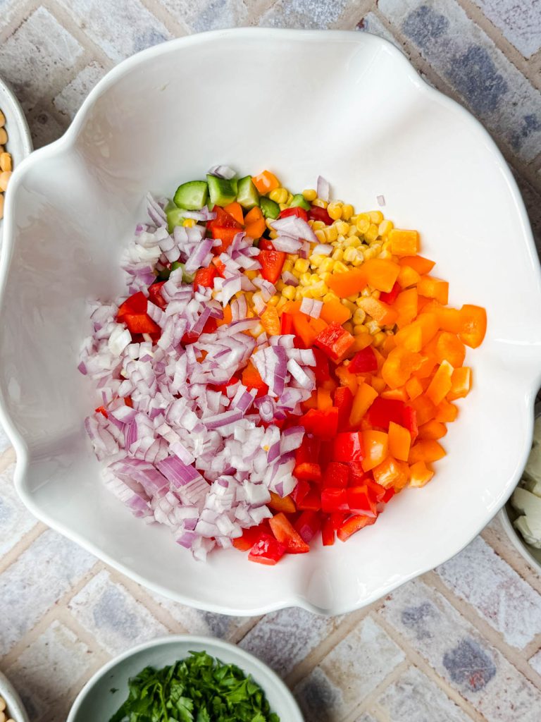 various chopped vegetables in a white serving bowl
