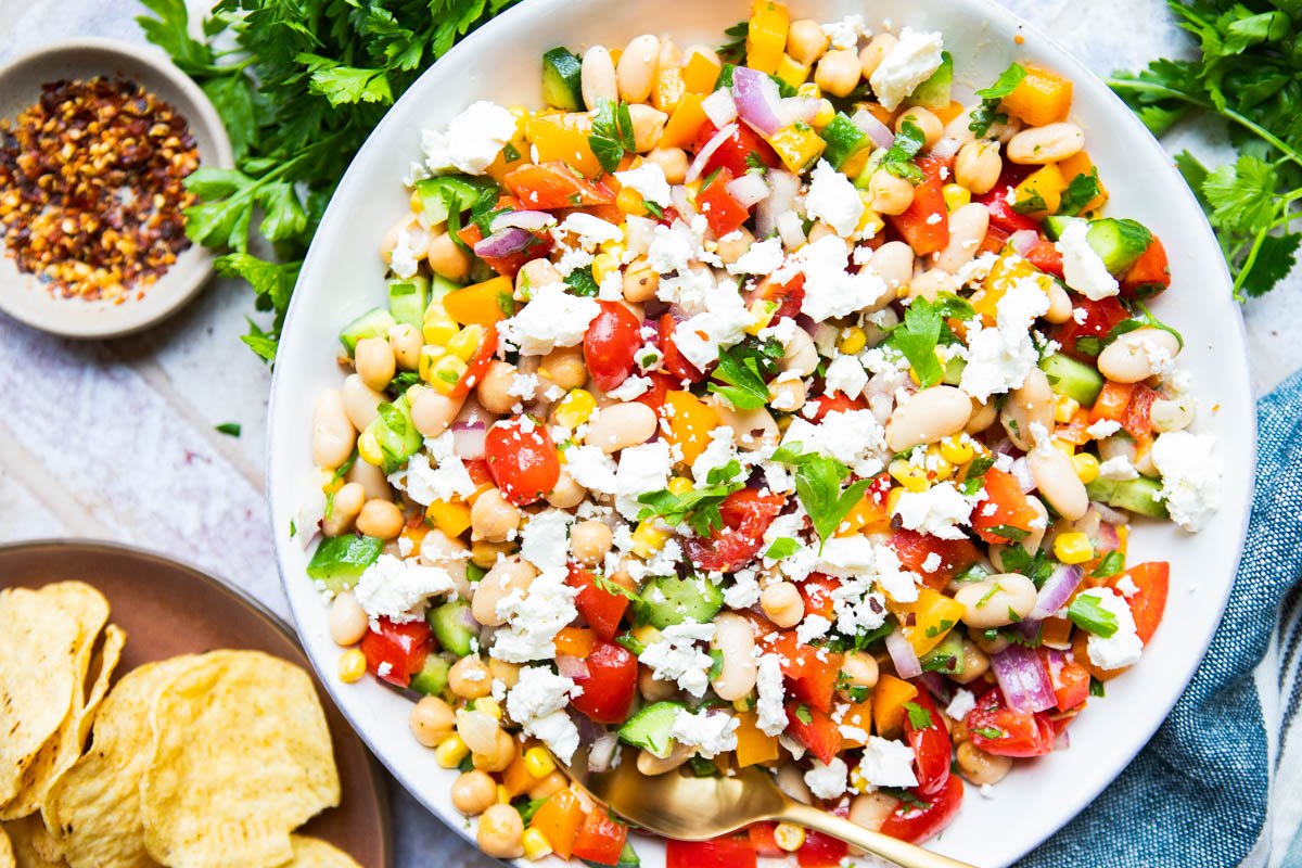 cowboy caviar recipe topped with feta cheese with tortilla chips