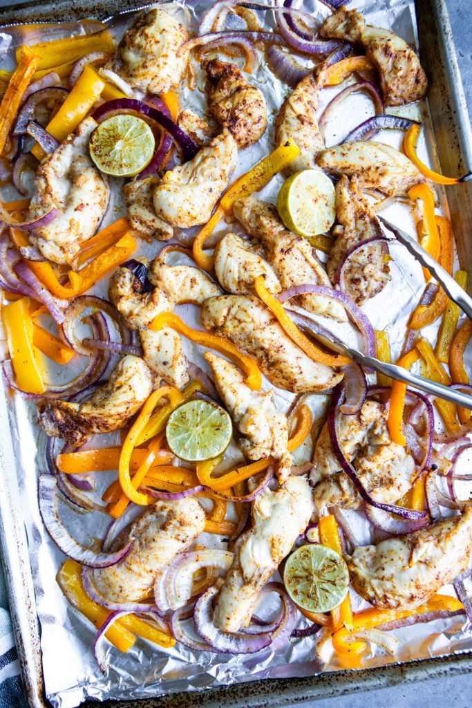 oven baked chicken fajitas on a sheet pan, just removed from the oven