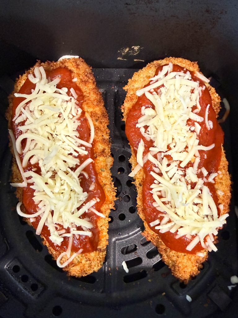 air fried chicken cutlet topped with marinara sauce and mozzarella cheese
