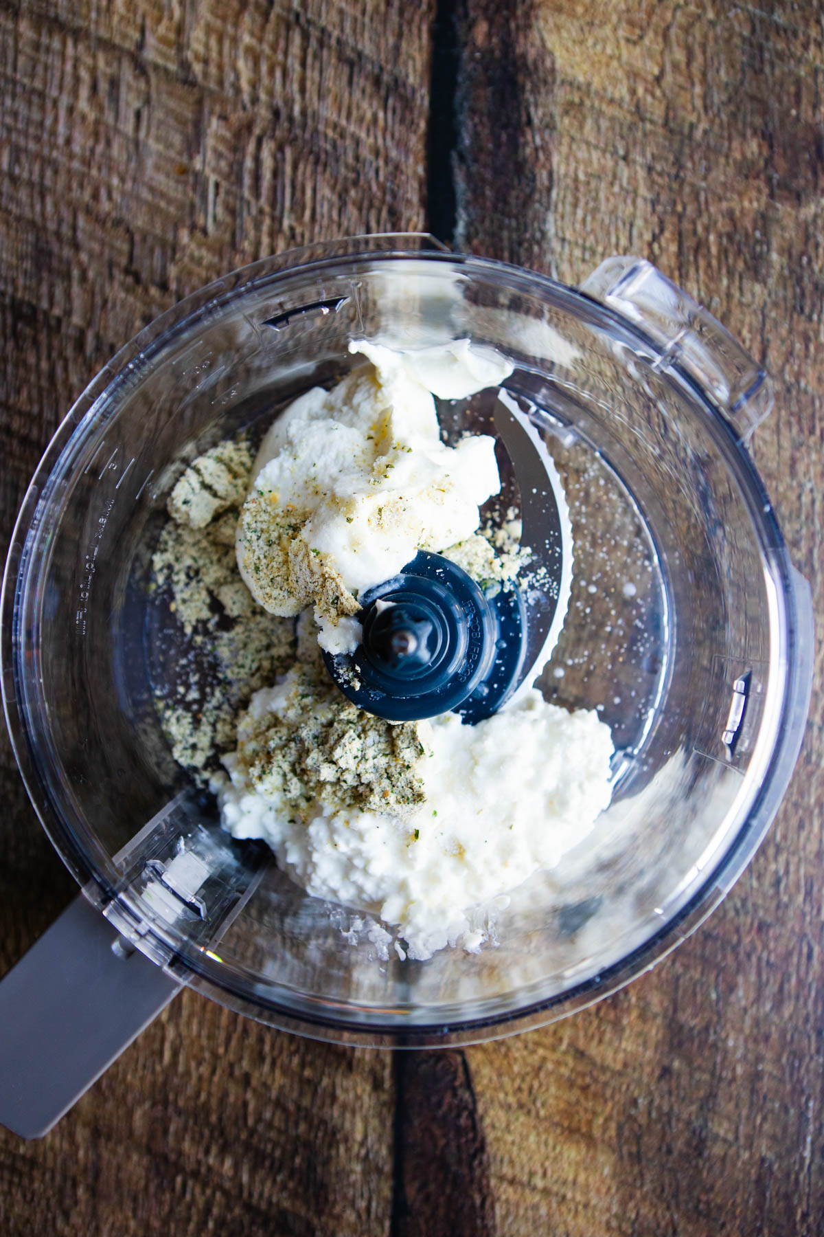 cottage cheese, yogurt and ranch seasoning mix added to the bowl of a food processor
