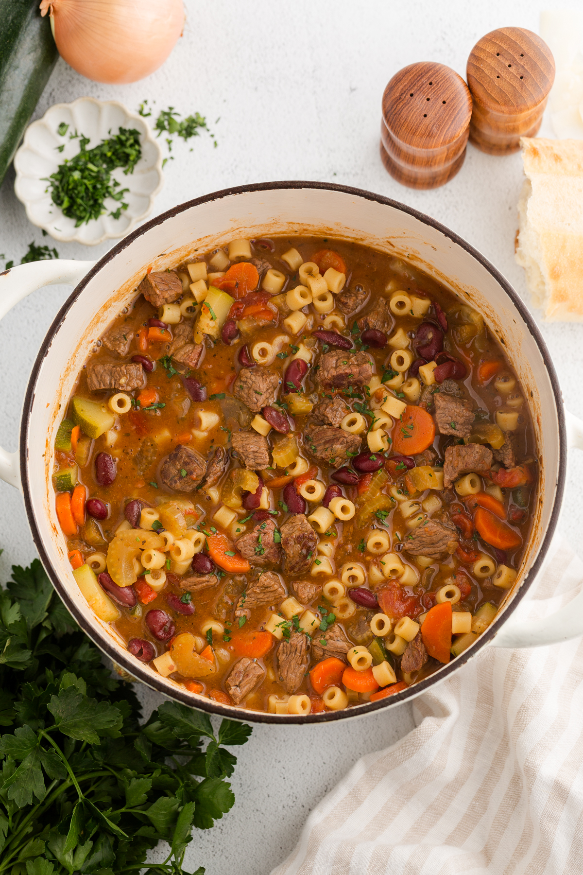 a large pot of high fiber high protein minestrone soup made with beef served in a large dutch oven pot