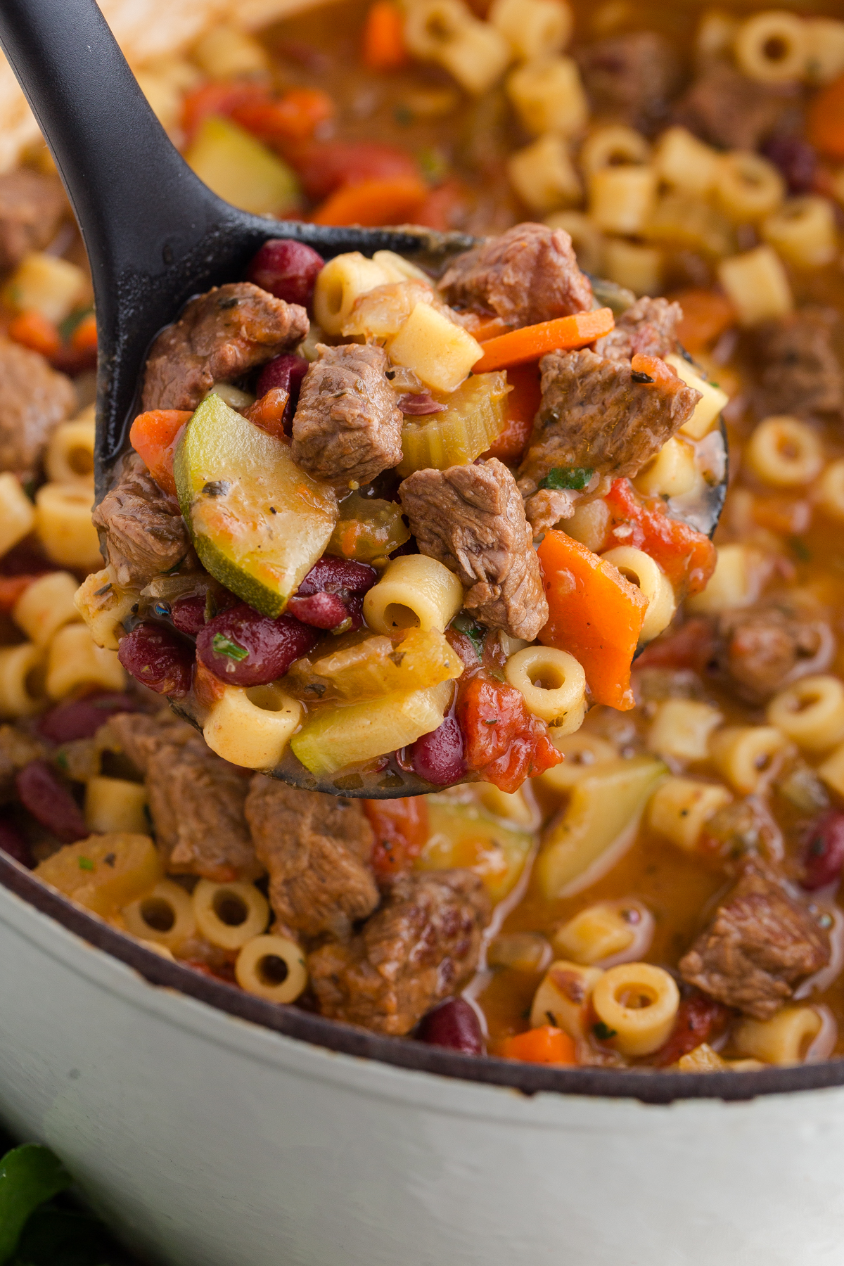 Italian beef minestrone soup made with ditalini pasta and served in a large Dutch oven
