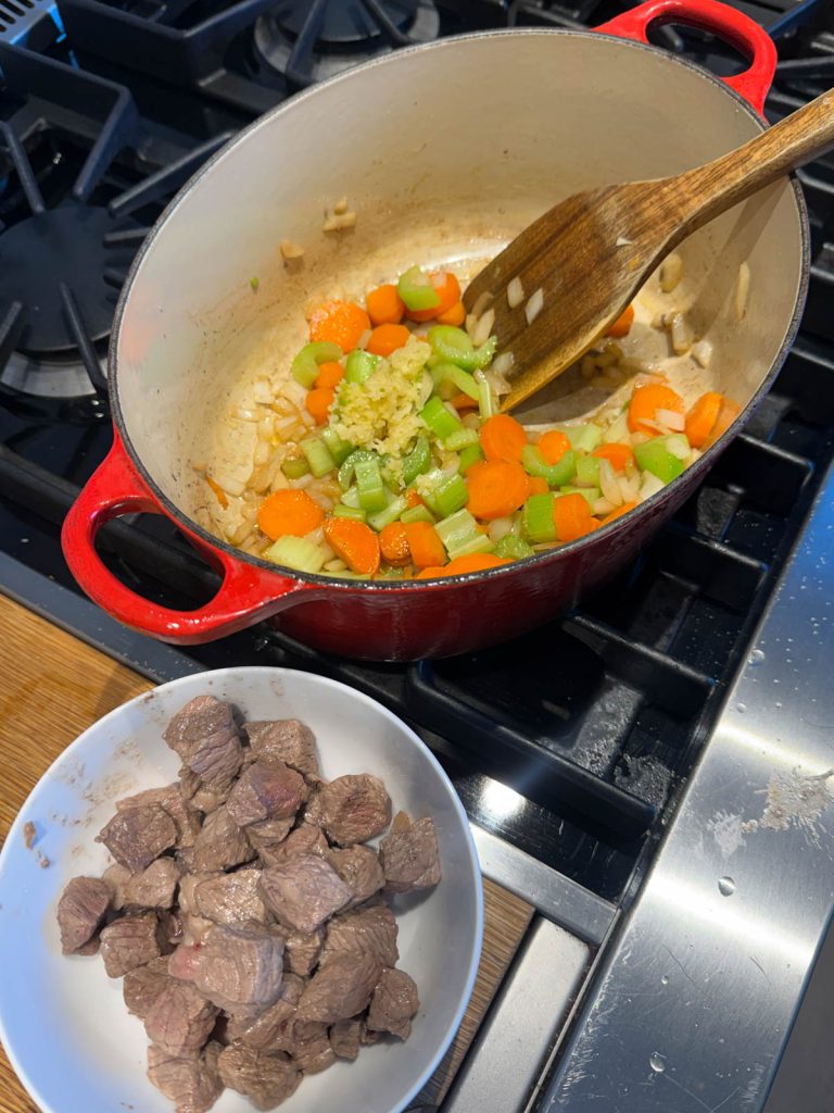 diced onions, carrots and celery to pot to sear
