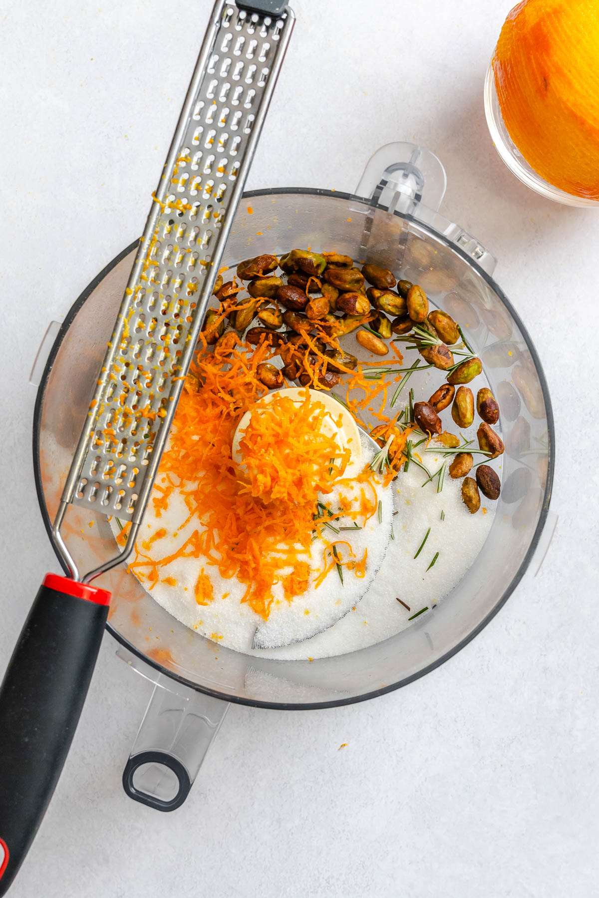 sugar pistachio topping ingredients added to a food processor