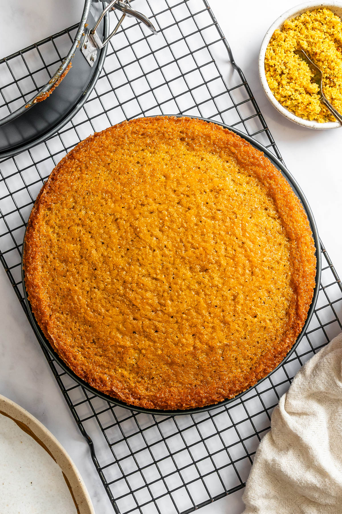 baked olive oil cake on a cooling rack