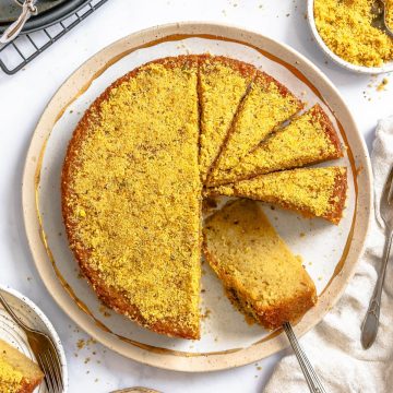 sliced olive oil cake on a ceramic plate