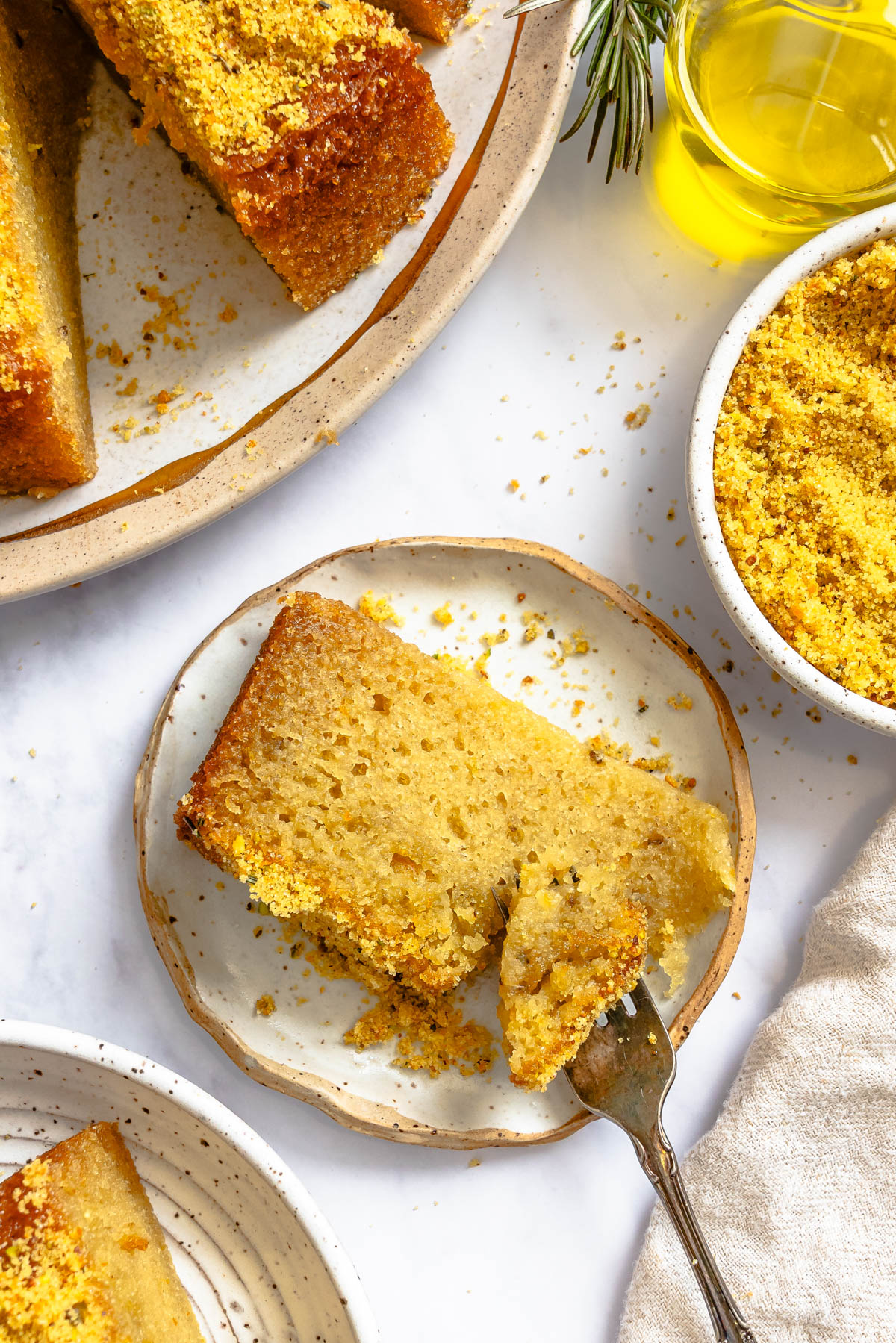 moist and tender Italian olive oil cake sliced and served on a dessert plate