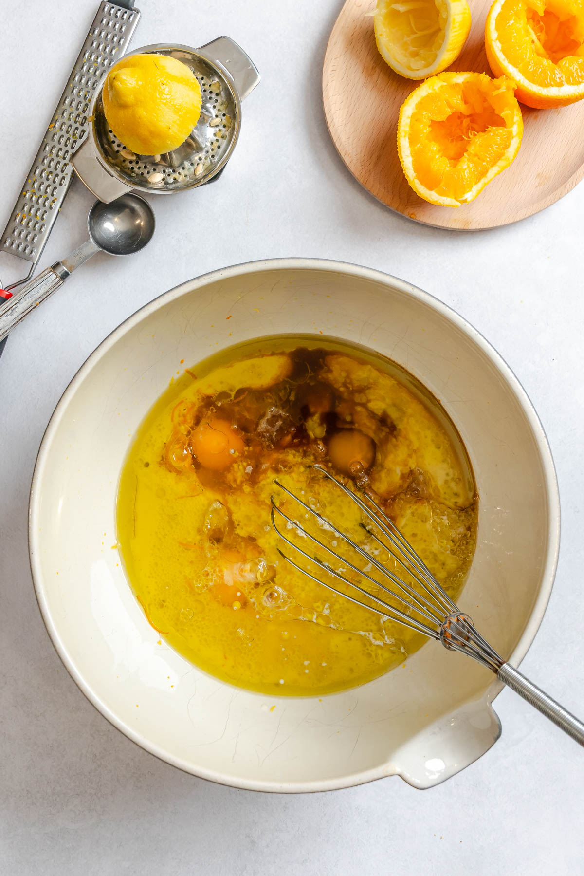 wet ingredients for an olive oil cake made in a bowl